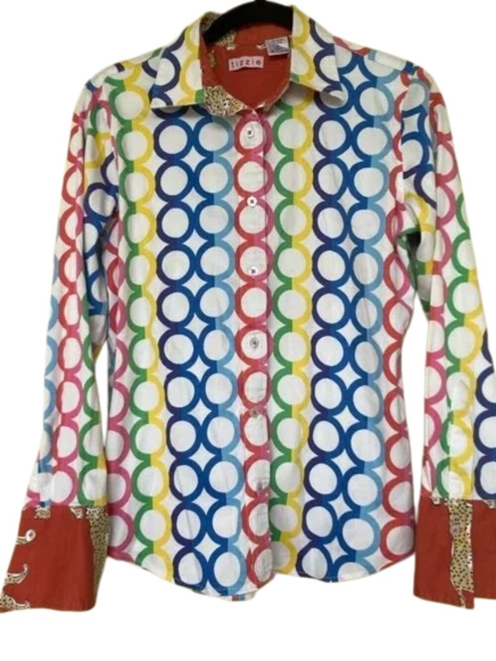 Tizzie Top with geometric circular patterns with hints of animal print